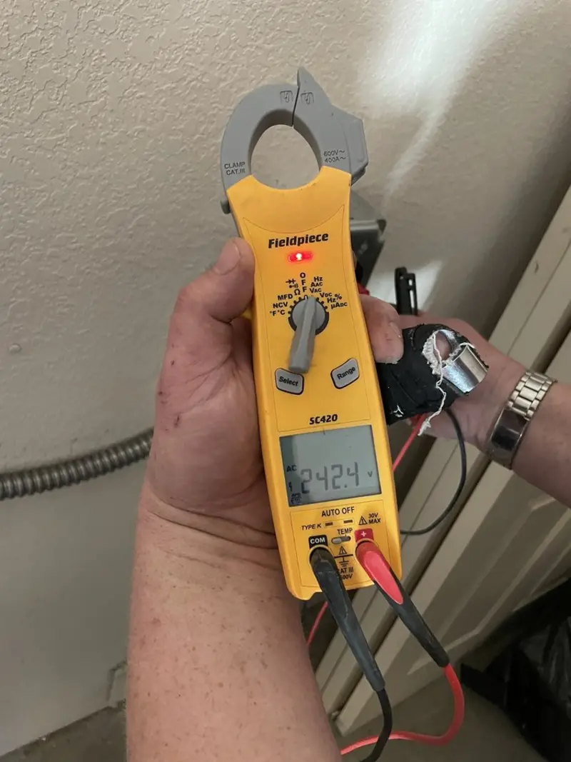 Voltage testing with clamp meter during Outlet Installation in Oakdale